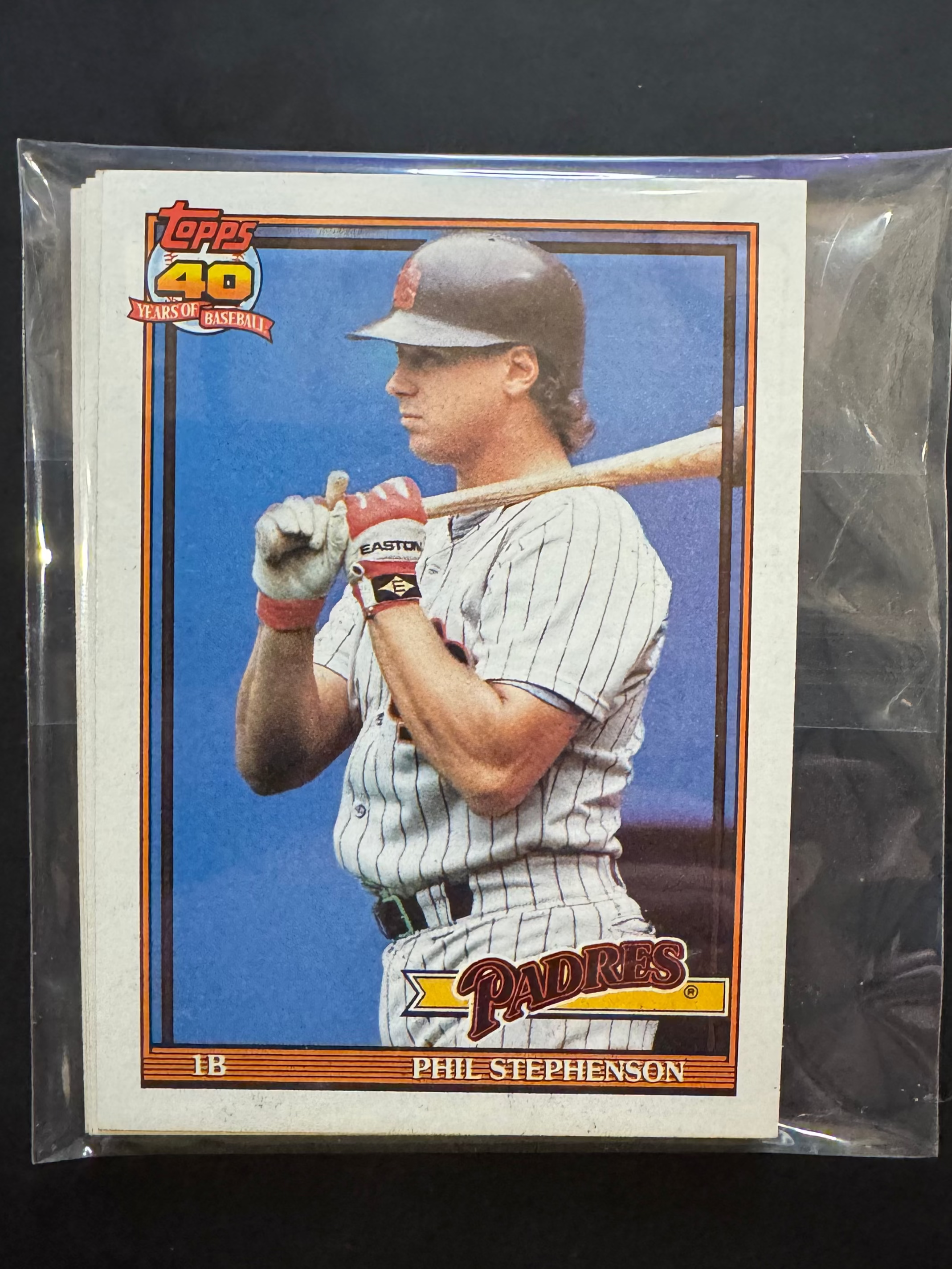 Baseball trading card of Phil Stephenson in a protective sleeve on a black background